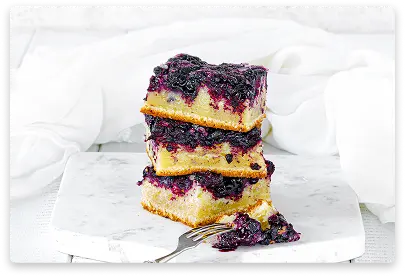 Sofioni cheese cake with black currant filling and fresh berry garnish