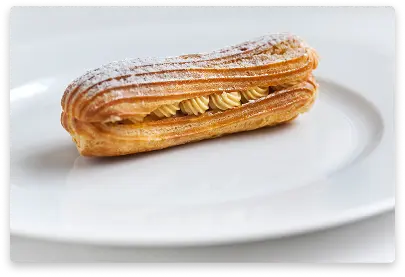 Traditional cream puff with vanilla filling and powdered sugar