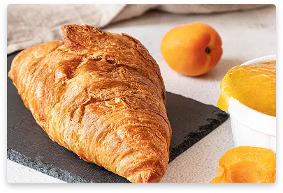 Buttery croissant filled with sweet apricot jam