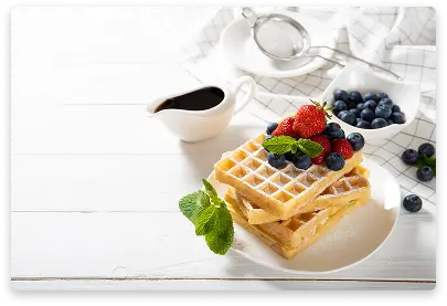 Triangular waffle pastry filled with cream in corner shape